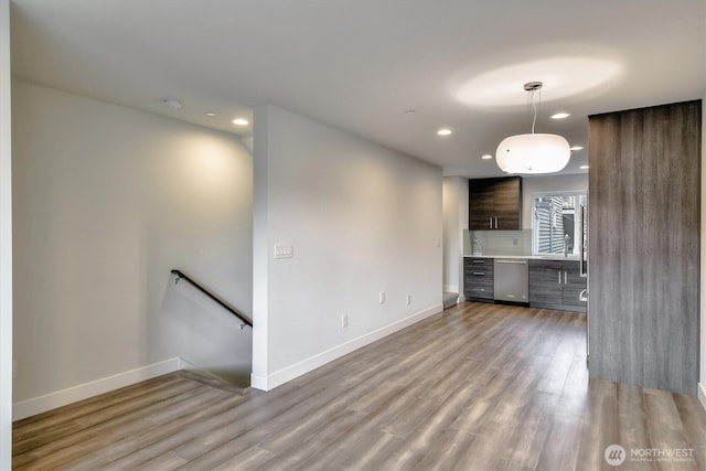 interior space with recessed lighting, baseboards, and light wood-style floors