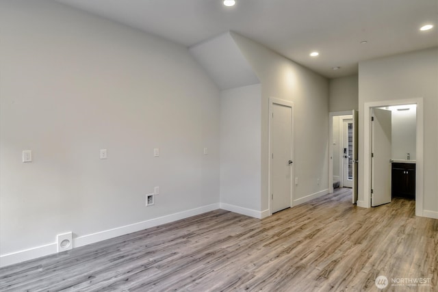 bonus room featuring recessed lighting, light wood-style floors, and baseboards