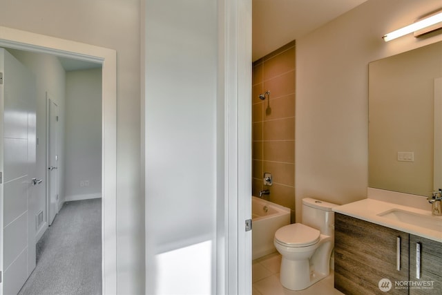 full bathroom featuring tile patterned floors, toilet, shower / washtub combination, and vanity