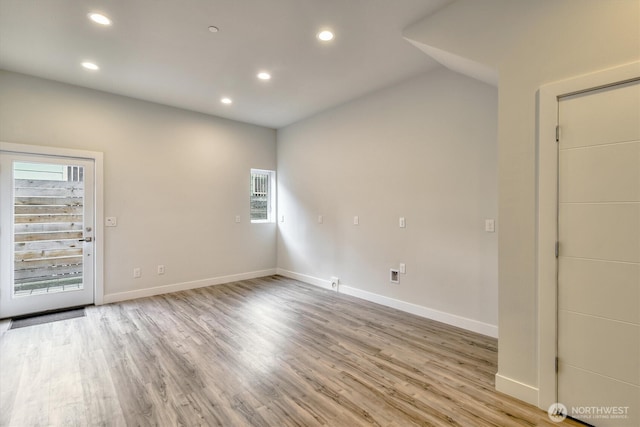 unfurnished room featuring plenty of natural light, recessed lighting, and light wood-type flooring