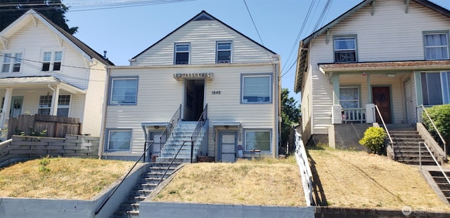 view of front of home featuring a porch and stairway