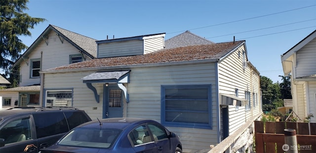 bungalow-style house featuring a shingled roof