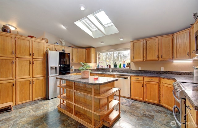 kitchen with open shelves, a center island, lofted ceiling, appliances with stainless steel finishes, and a sink