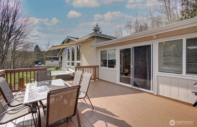 wooden terrace featuring outdoor dining area