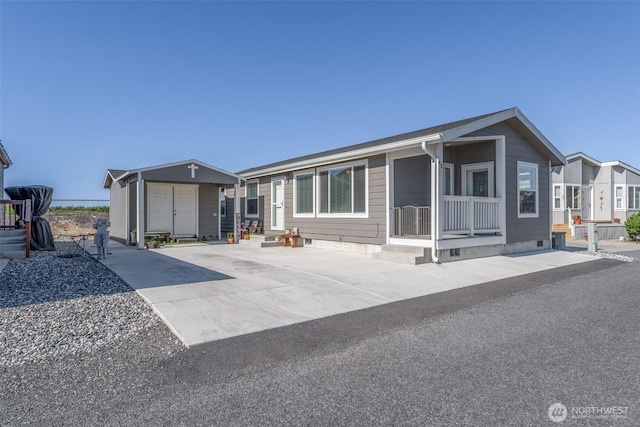 view of front of home with an outbuilding, a storage unit, and crawl space