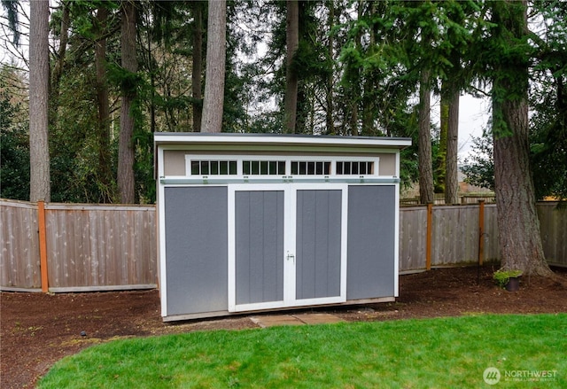 view of shed featuring a fenced backyard