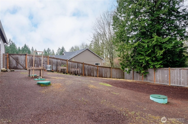 view of yard with a fenced backyard