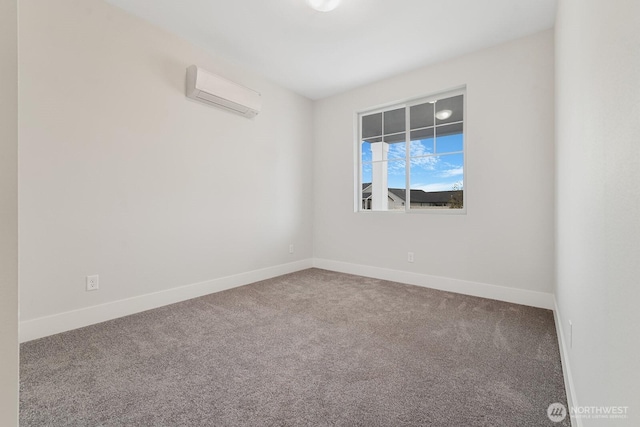 carpeted empty room featuring a wall mounted AC and baseboards