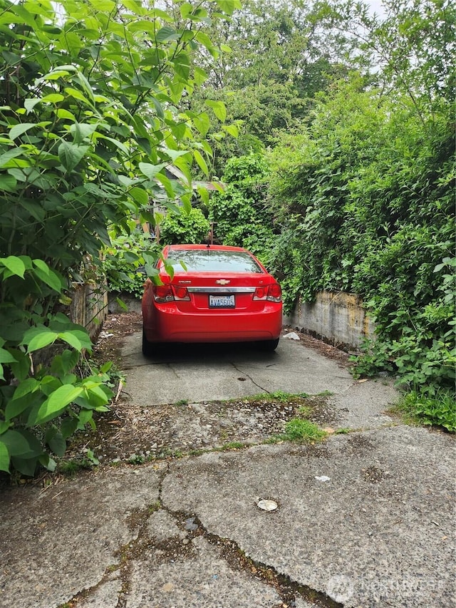 view of parking featuring fence