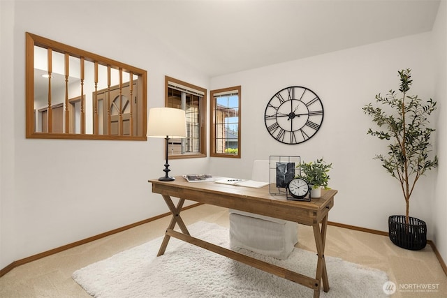 home office featuring carpet flooring and baseboards