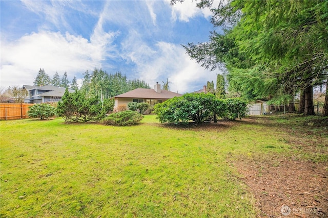 view of yard featuring fence