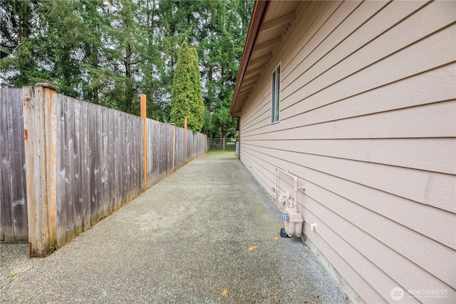 view of side of property with fence