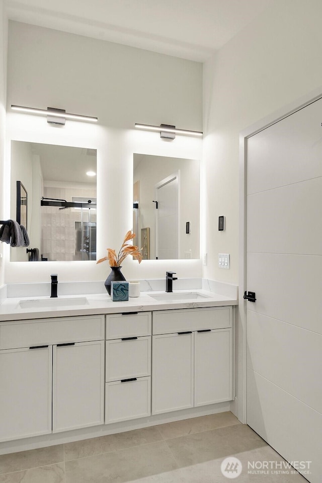 full bathroom featuring a sink and double vanity