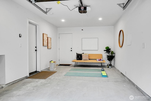 garage featuring recessed lighting and a garage door opener