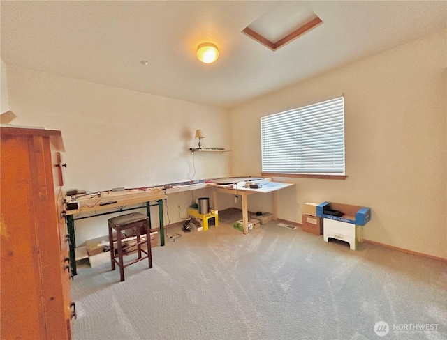 carpeted office featuring baseboards