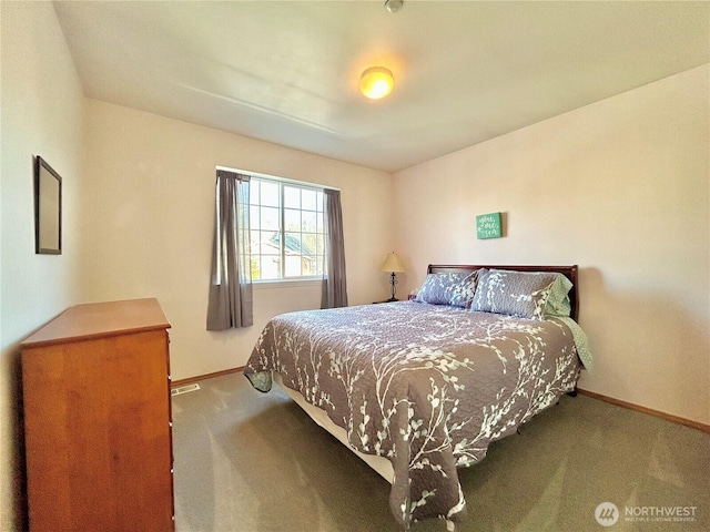 carpeted bedroom featuring baseboards