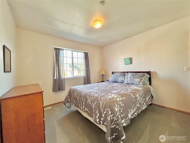 carpeted bedroom featuring baseboards