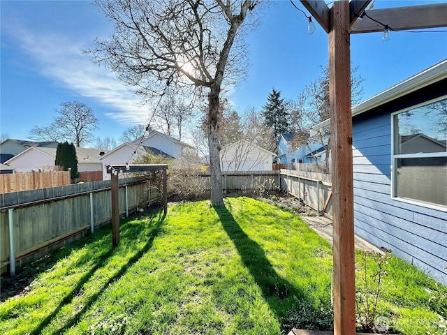 view of yard with a fenced backyard