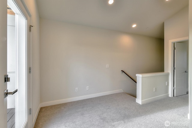 spare room with recessed lighting, baseboards, and carpet floors