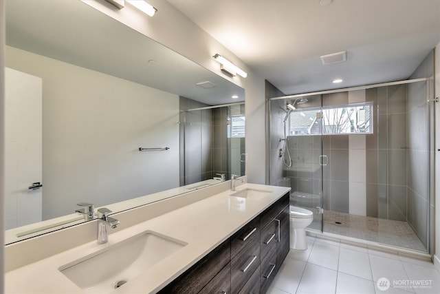 full bathroom with a sink, toilet, and a shower stall