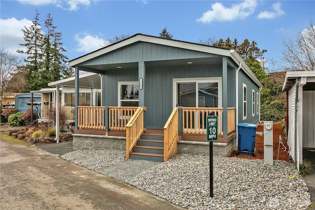 back of property featuring a porch