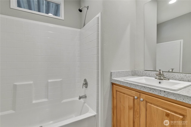 full bathroom featuring vanity and  shower combination