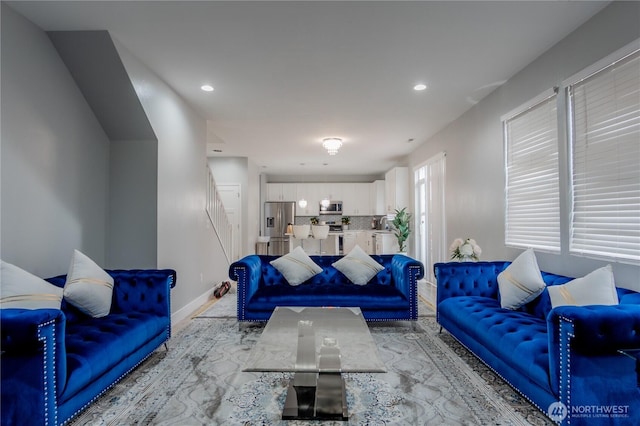 living room with recessed lighting and baseboards