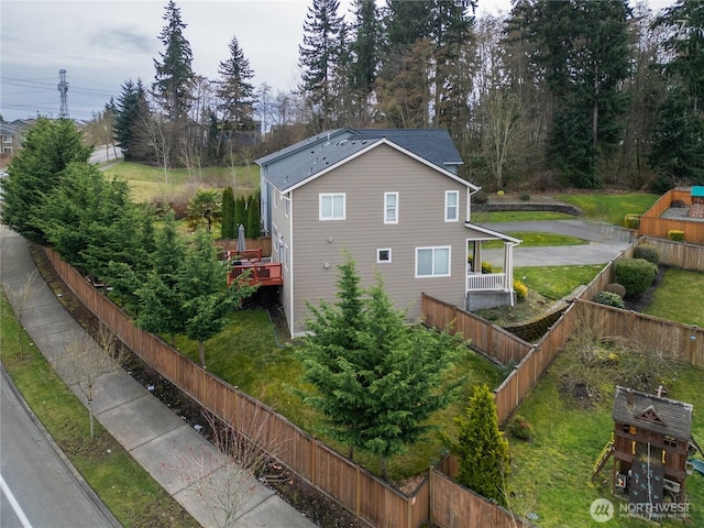 view of property exterior with a fenced backyard