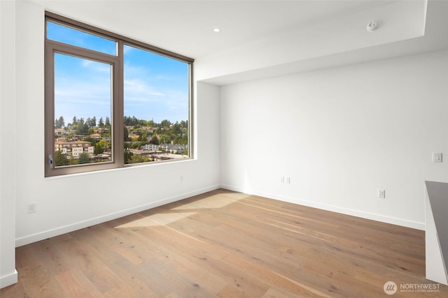 10232 NE 10th St Unit 1015, Bellevue, WA 98004 - unfurnished room featuring wood finished floors, a smoke detector, and recessed lighting