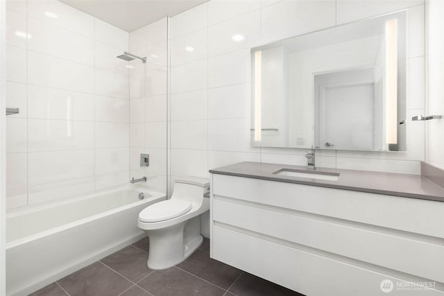 10232 NE 10th St Unit 1015, Bellevue, WA 98004 - bathroom featuring vanity, washtub / shower combination, tile patterned floors, and tile walls
