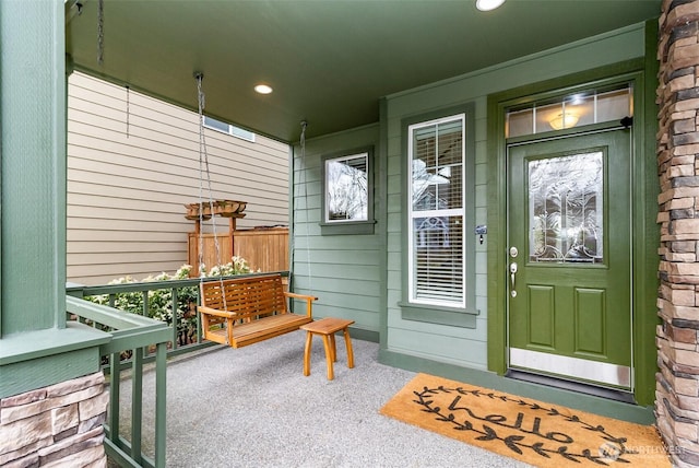 property entrance featuring a porch