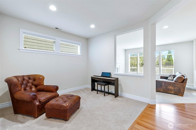 sitting room with visible vents, recessed lighting, carpet flooring, and baseboards