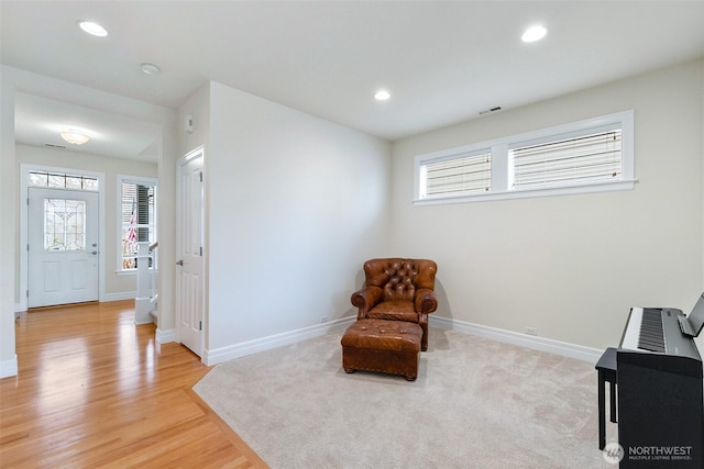 sitting room with recessed lighting, baseboards, and light wood-style floors