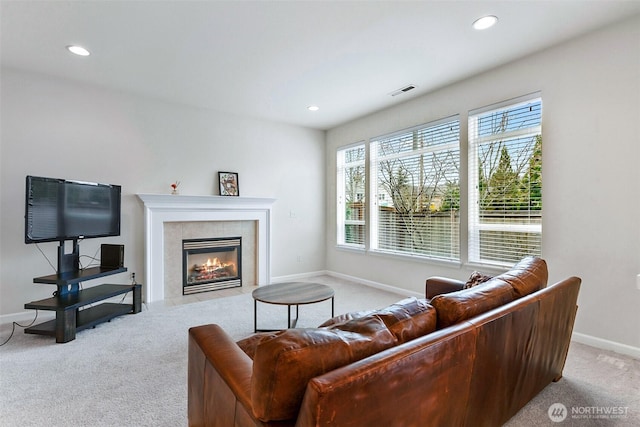 living area with recessed lighting, baseboards, a fireplace, and carpet flooring