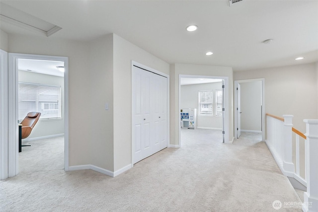 hallway with recessed lighting, an upstairs landing, carpet, and a healthy amount of sunlight