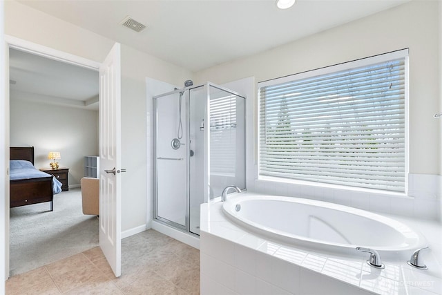 full bath with tile patterned floors, visible vents, connected bathroom, a shower stall, and a bath