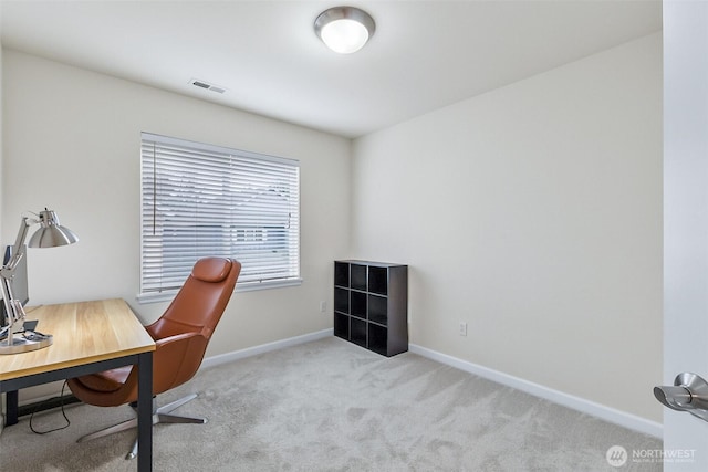 home office with visible vents, baseboards, and carpet flooring