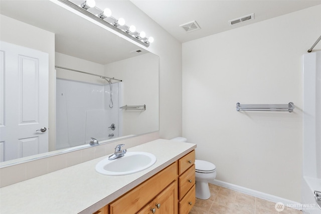 bathroom featuring visible vents, toilet, vanity, and baseboards