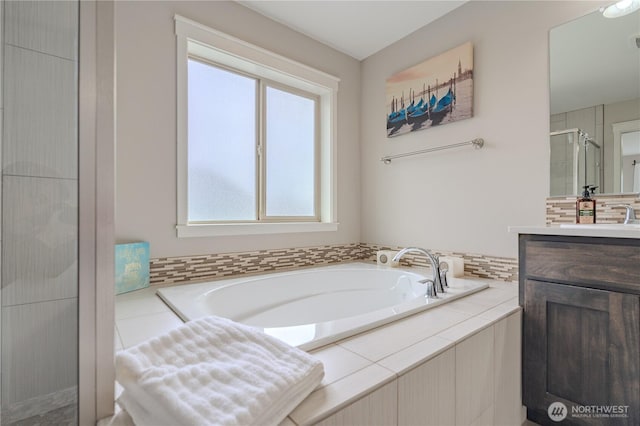 16103 NE 102nd Way, Vancouver, WA 98682 - bathroom with a shower stall, vanity, a garden tub, and backsplash