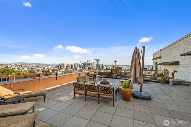 view of patio / terrace featuring a city view and outdoor lounge area