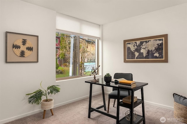 home office with baseboards and carpet floors