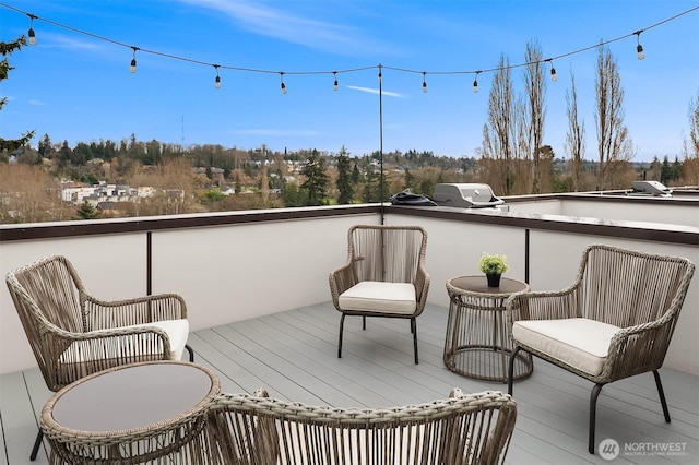 wooden deck featuring grilling area