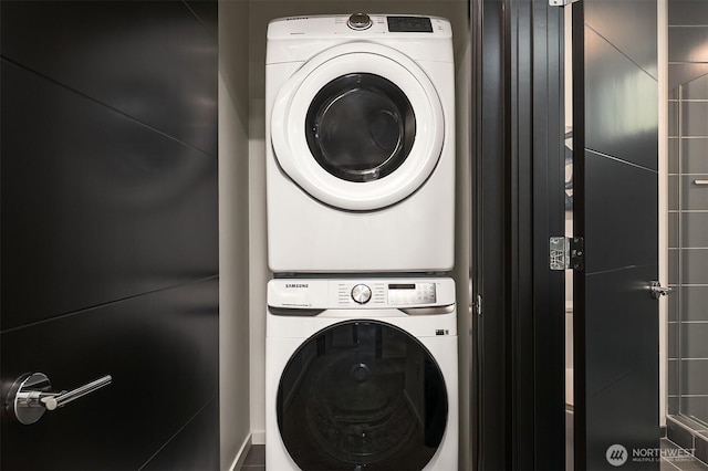 laundry room with laundry area and stacked washer / dryer