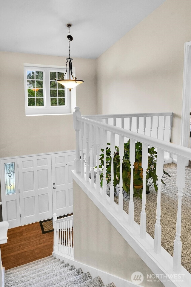 stairs with wood finished floors