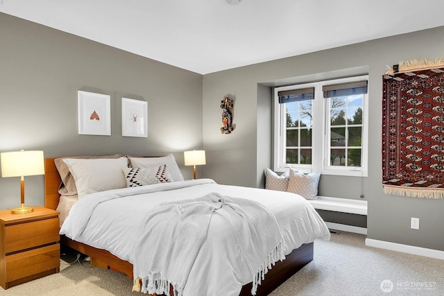 bedroom with carpet flooring and baseboards