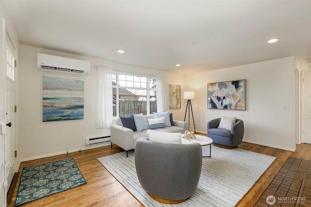 living room with recessed lighting, an AC wall unit, a baseboard heating unit, and wood finished floors