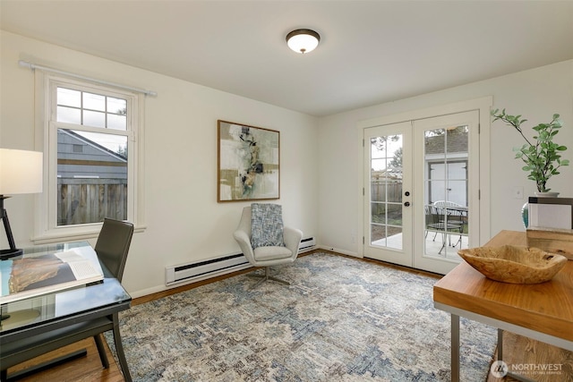 office featuring a baseboard heating unit, wood finished floors, french doors, and baseboards