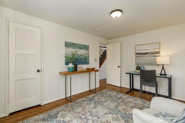 home office with wood finished floors and baseboards