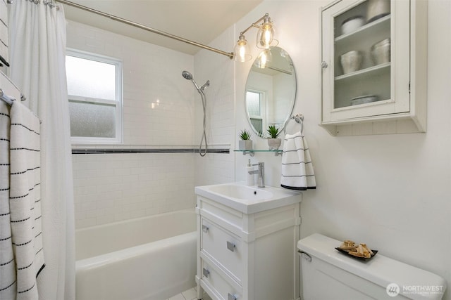 full bath with toilet, vanity, and shower / bath combination with curtain