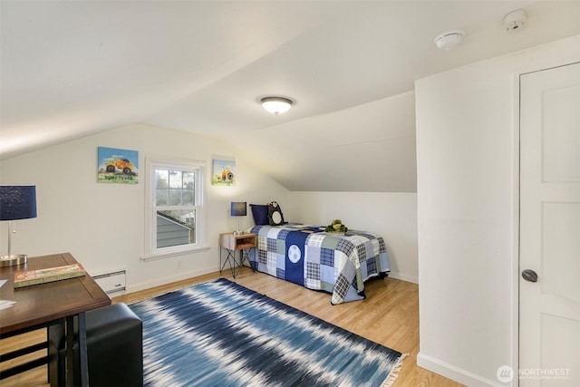 bedroom featuring light wood-type flooring, lofted ceiling, baseboards, and a baseboard radiator